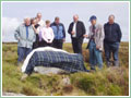 K J MacKay unveils the plaque on the Angus Graham stone on Barvas Moor